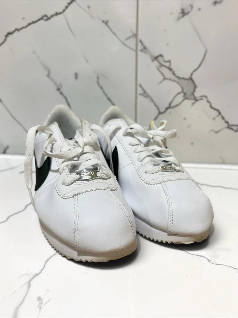 Nike Men’s White Leather Sneakers with Black Swoosh